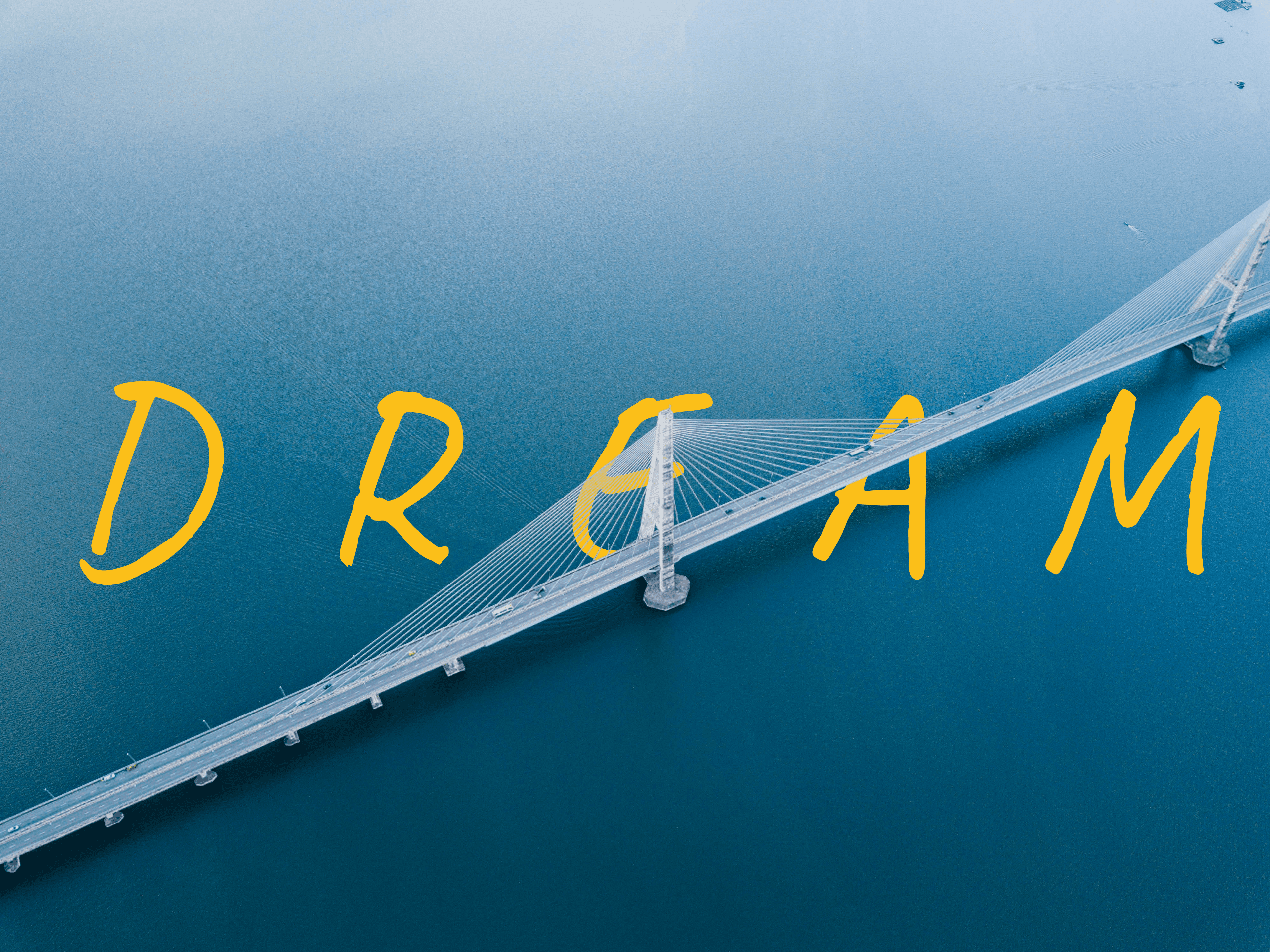 Text behind image effect — DREAM text placed behind a suspension bridge over water